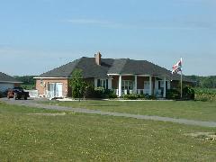 farmhouse (notice Canadian & American flags - quite unusual)