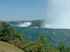 view over Horseshoe Falls with American Falls and Rainbow Bridge in background