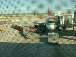 John's bike getting loaded onto the plane