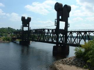 Vertical rising train bridge